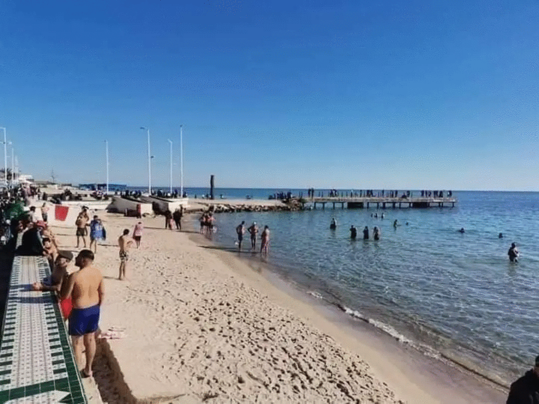 Tunisians swimming in the beach of Hammamet