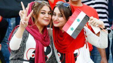 Two Syrian fans in the Azadi Stadium in Tehran, Iran during an Iran-Syria game. Via The Guadian. Photograph: Abedin Taherkenzareh/ EPA